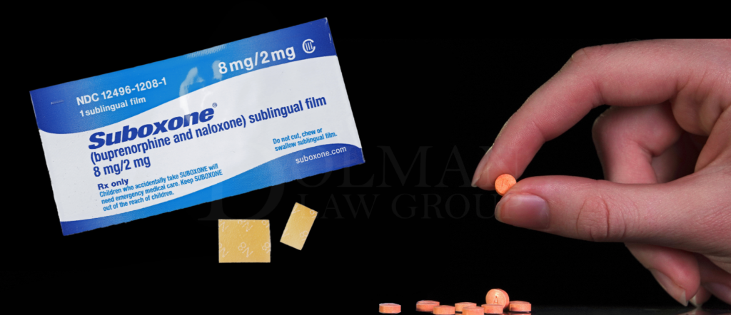 A Suboxone film strip and a hand holding a Suboxone tablet on a black background